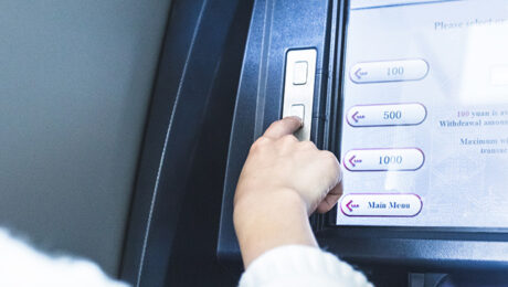 Woman using cash machine-ATM,close up view