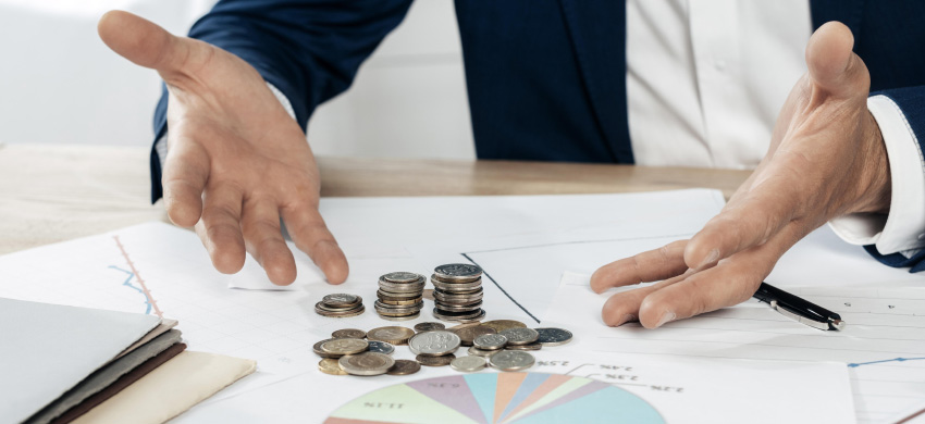 close-up-man-with-coins-statistics-850